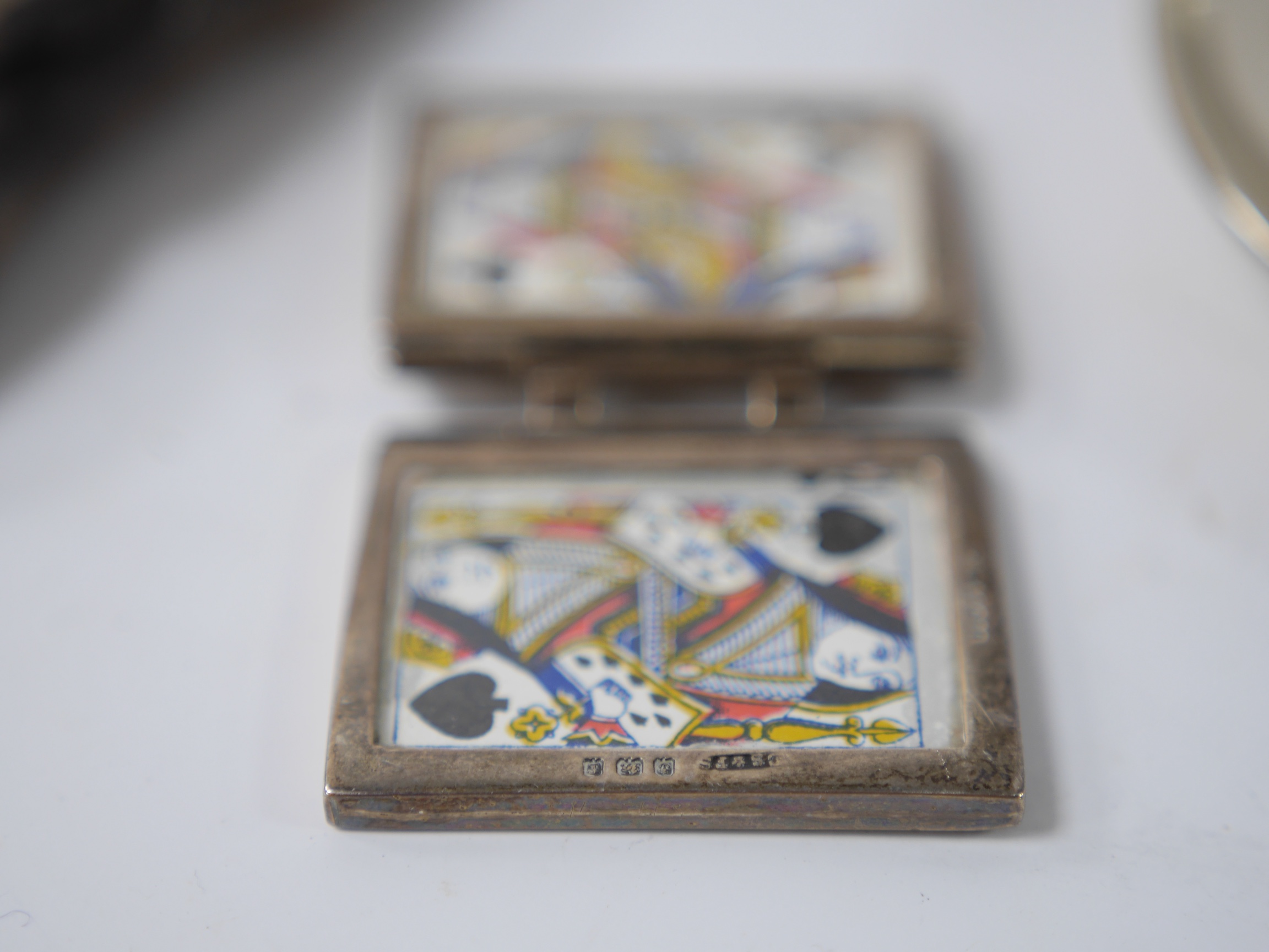 Four small mounted photograph frames, including a double by Saunders & Shepherd, Birmingham, 1905, 45mm, a silver dish, a silver napkin ring and five items of silver flatware. Condition - poor to fair